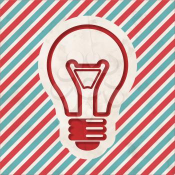 Light Bulb Icon on Red and Blue Striped Background. Vintage Concept in Flat Design.