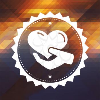 Charity Concept - Icon of Heart in the Hand. Retro label design. Hipster background made of triangles, color flow effect.