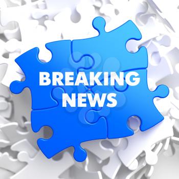 Breaking News on Blue Puzzle on White Background.