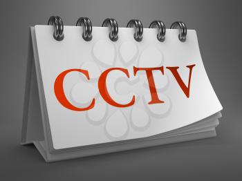 CCTV - Red Word on White Desktop Calendar Isolated on Gray Background.