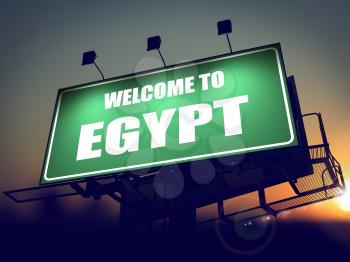 Welcome to Egypt - Green Billboard on the Rising Sun Background.