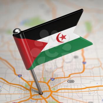 Small Flag of Sahrawi Arab Democratic Republic on a Map Background with Selective Focus.