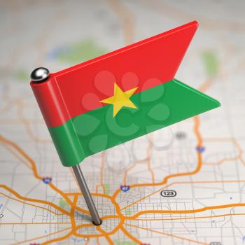 Small Flag of Burkina Faso on a Map Background with Selective Focus.