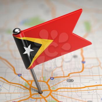 Small Flag of Democratic Republic of Timor-Leste on a Map Background with Selective Focus.