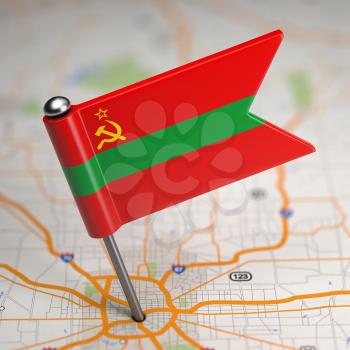 Small Flag of Pridnestrovian Moldavian Republic on a Map Background with Selective Focus.