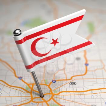 Small Flag of Turkish Republic of Northern Cyprus on a Map Background with Selective Focus.