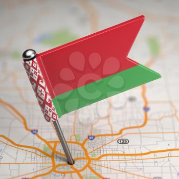 Small Flag of Republic of Belarus on a Map Background with Selective Focus.