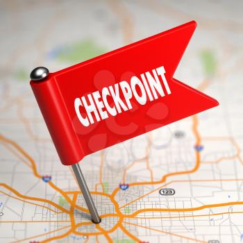 Checkpoint Concept - Small Flag on a Map Background with Selective Focus.