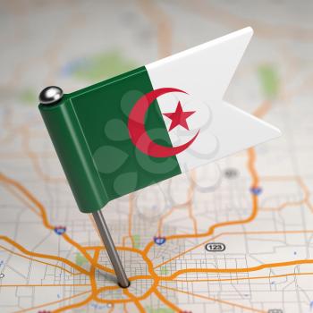 Small Flag of The People's Democratic Republic of Algeria on a Map Background with Selective Focus.