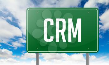 CRM. Highway Signpost with wording on Sky Background,