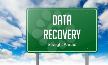 Highway Signpost with Data Recovery wording on Sky Background.