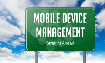 Highway Signpost with Mobile Device Management  wording on Sky Background.