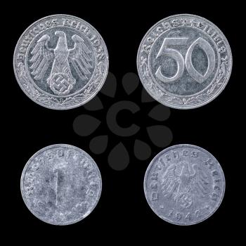 Obverse and Reverse of Two German Coins on a Black Background.