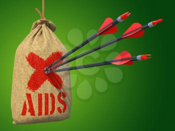 AIDS - Three Arrows Hit in Red Target Hanging on the Sack on Green Background.