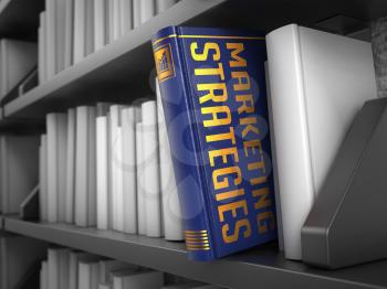 Marketing Strategies - Blue Book on the Black Bookshelf between white ones.