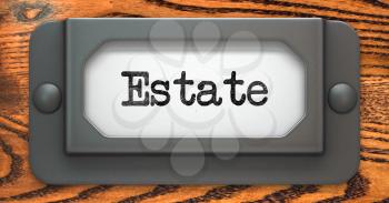 Estate - Inscription on File Drawer Label on a Wooden Background.
