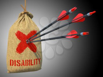 Disability - Three Arrows Hit in Red Mark Target on a Hanging Sack on Grey Background.