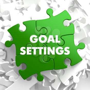 Goal Settings on Green Puzzle on White Background.