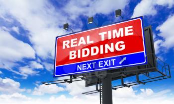 Real Time Bidding - Red Billboard on Sky Background. Business Concept.