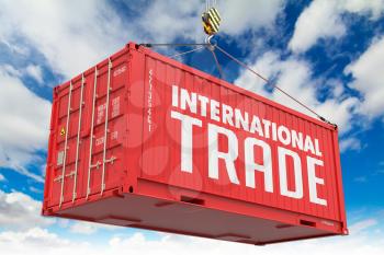 International Trade - Red Hanging Container on Sky Background.