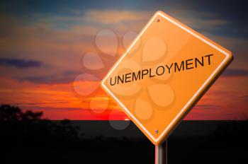 Unemployment on Warning Road Sign on Sunset Sky Background.