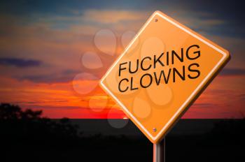 Fucking Clowns on Warning Road Sign on Sunset Sky Background.