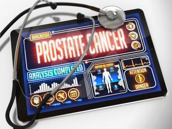 Medical Tablet with the Diagnosis of Prostate Cancer on the Display and a Black Stethoscope on White Background.