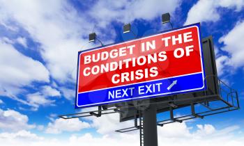Budget in the Conditions of Crisis - Red Billboard on Sky Background. Business Concept.