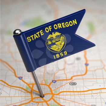 Small Flag of Oregon on a Map Background with Selective Focus.