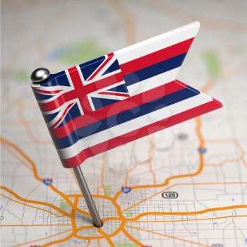 Small Flag of Hawaii on a Map Background with Selective Focus.