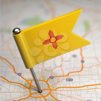 Small Flag of New Mexico on a Map Background with Selective Focus.