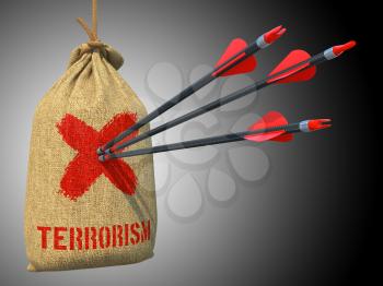 Terrorism - Three Arrows Hit in Red Target on a Hanging Sack on Green Bokeh Background.