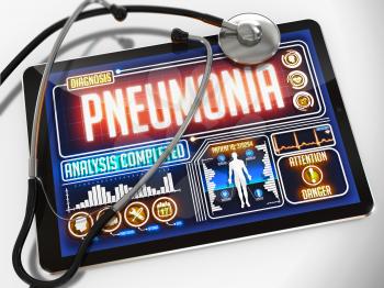 Pneumonia - Diagnosis on the Display of Medical Tablet and a Black Stethoscope on White Background.
