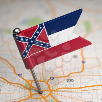 Small Flag of Mississippi on a Map Background with Selective Focus.