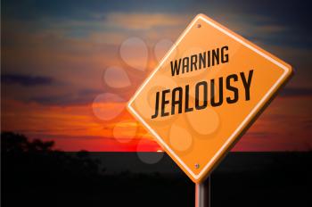 Jealousy on Warning Road Sign on Sunset Sky Background.