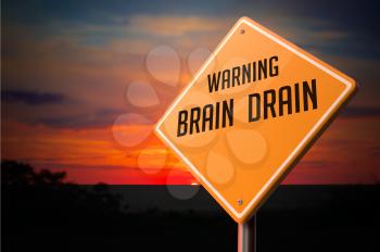 Brain Drain on Warning Road Sign on Sunset Sky Background.