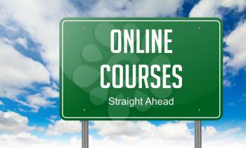 Online Courses on Green Highway Signpost on Sky Background.