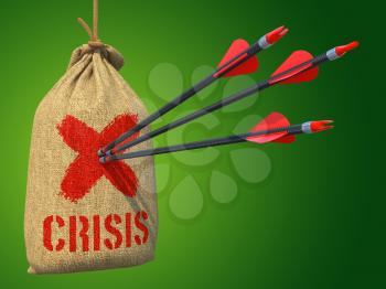 Crisis - Three Arrows Hit in Red Target on a Hanging Sack on Green Background.