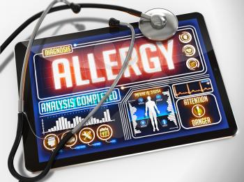 Medical Tablet with the Diagnosis of Allergy  on the Display and a Black Stethoscope on White Background.