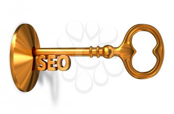 Seo - Golden Key is Inserted into the Keyhole Isolated on White Background
