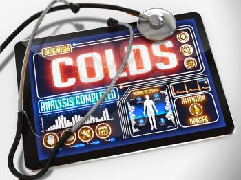 Colds - Diagnosis on the Display of Medical Tablet and a Black Stethoscope on White Background.