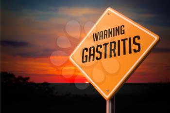 Gastritis on Warning Road Sign on Sunset Sky Background.