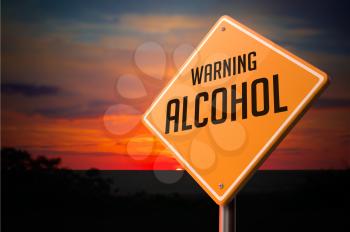 Alcohol on Warning Road Sign on Sunset Sky Background.