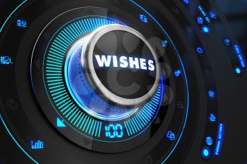 Wishes Button with Glowing Blue Lights on Black Console.