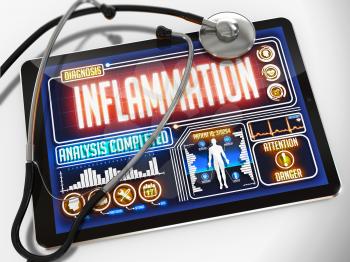 Inflammation - Diagnosis on the Display of Medical Tablet and a Black Stethoscope on White Background.