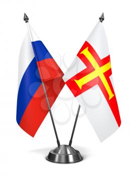 Royalty Free Clipart Image of Russia and Guernsey Miniature Flags