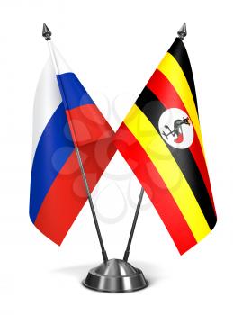 Russia and Uganda - Miniature Flags Isolated on White Background.