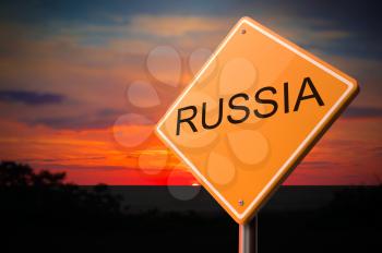Russia on Warning Road Sign on Sunset Sky Background.