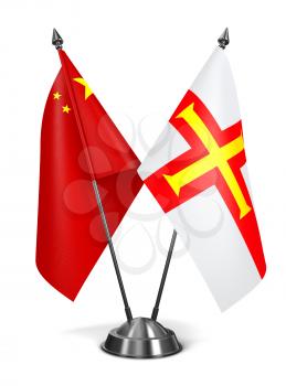 China and Guernsey - Miniature Flags Isolated on White Background.