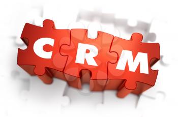 CRM - White Word on Red Puzzles on White Background. 3D Illustration.